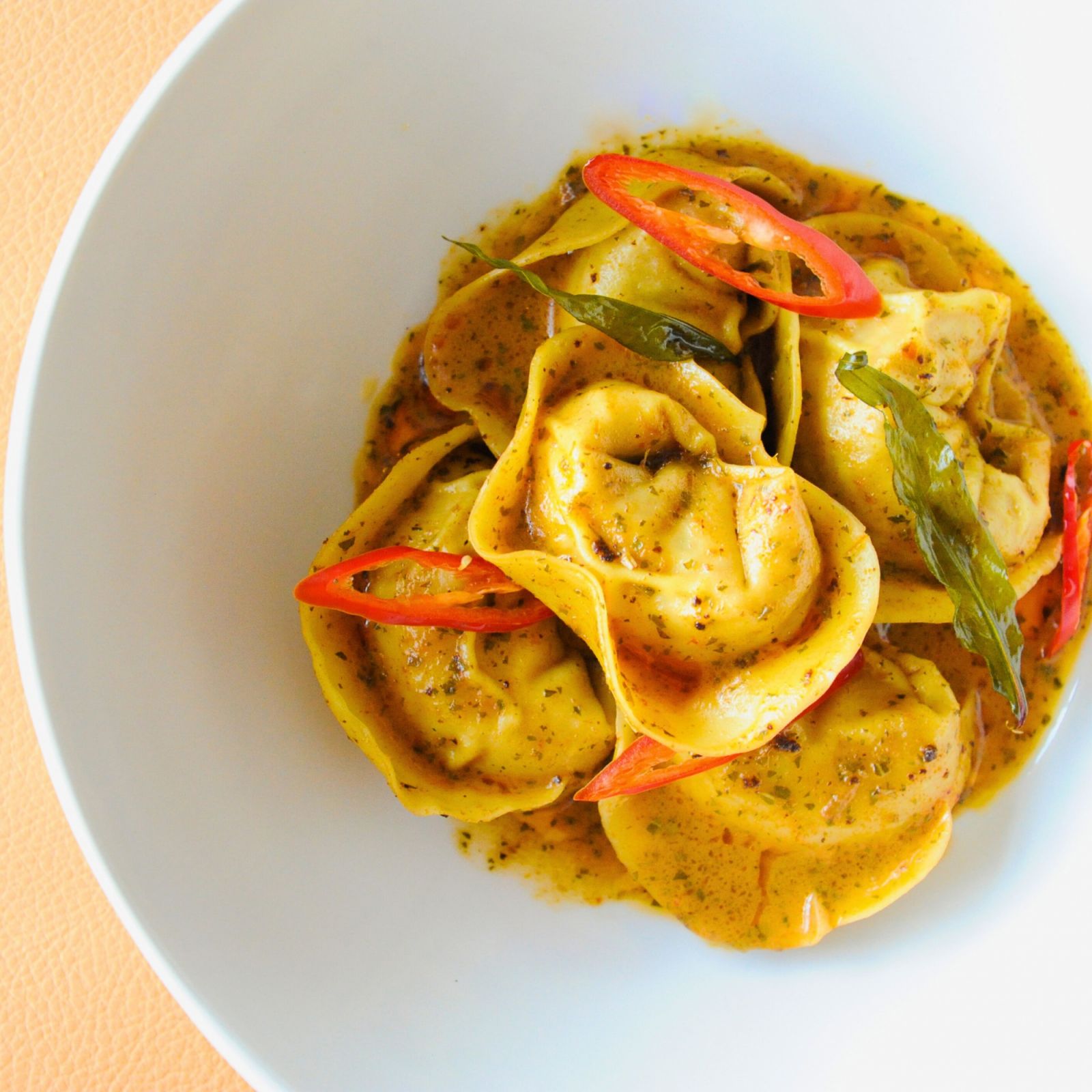The otah tortellini with rich laksa butter reveals a Singaporean twist on the Italian dish perfectly suited for Singapore's 59th birthday (Photo: Instagram / @caffefernetsg) National Day fireworks restaurant