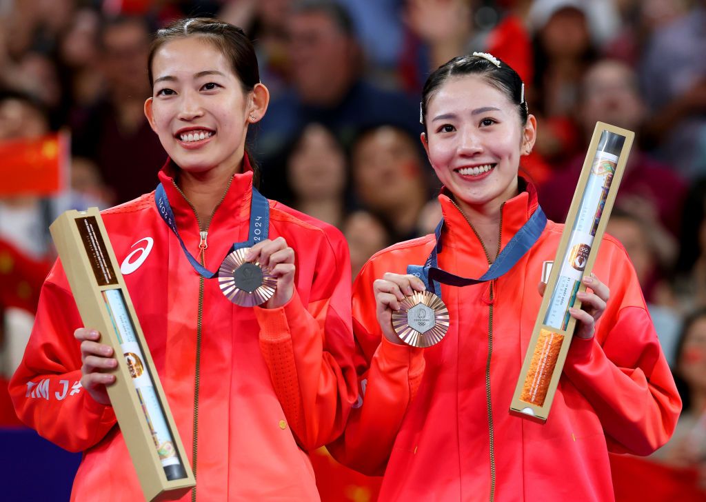 PARIS, FRANCE - AUGUST 03: Bronze Medallists, Nami Matsuyama and Chiharu Shida of Team Japan pose for a photo on the podium after the Women's Doubles on day eight of the Olympic Games Paris 2024 at Porte de La Chapelle Arena on August 03, 2024 in Paris, France. (Photo by Elsa/Getty Images)