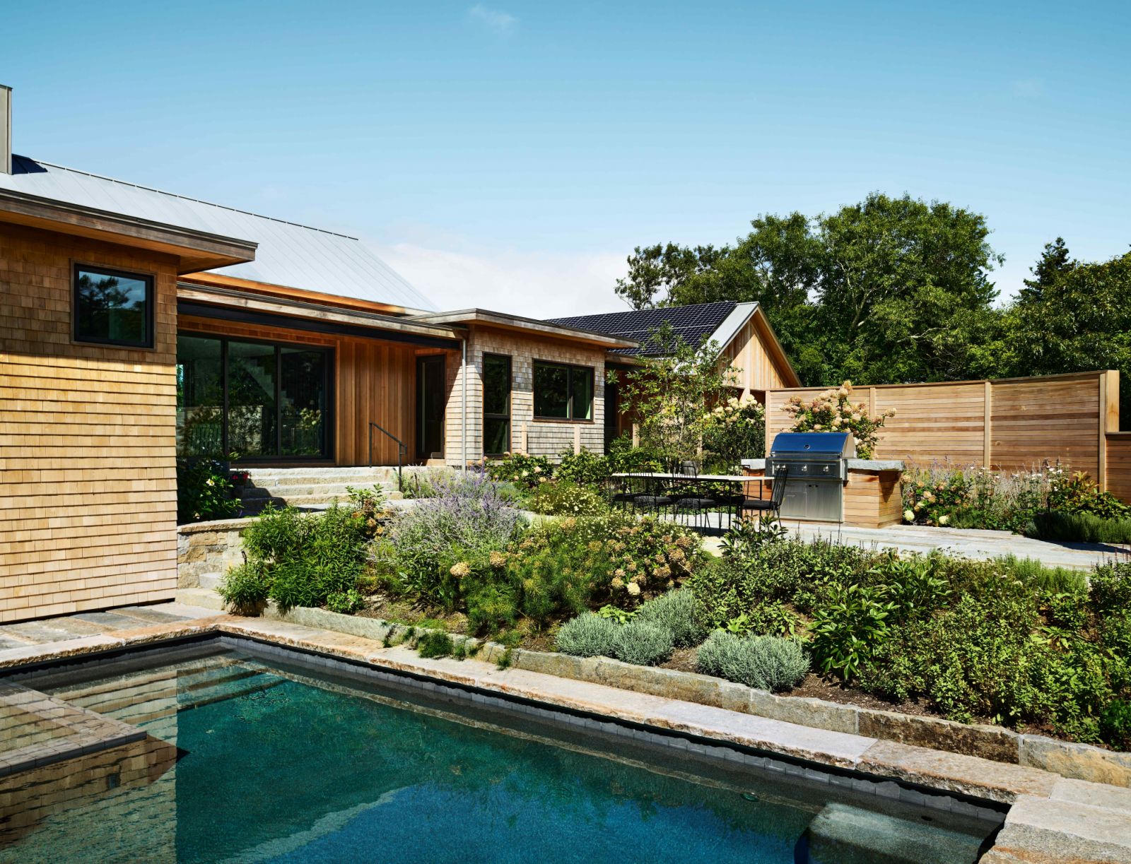 The landscaping around the plunge pool evokes a Mediterranean ambiance