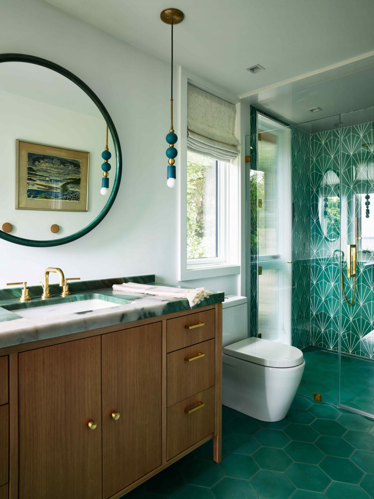 Another bathroom features statement jade green accents