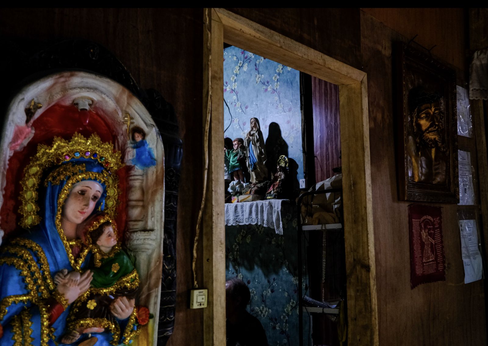 Various religious figures that can be seen in the healer's home (Photo: Macy Castañeda Lee)
