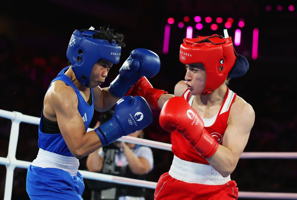 PARIS, FRANCE - AUGUST 06: Aira Villegas of Team Philippines and Buse Naz Cakiroglu of Team Turkey exchange punches during the Women's 50kg Semifinal match on day eleven of the Olympic Games Paris 2024 at Roland Garros on August 06, 2024 in Paris, France. (Photo by Richard Pelham/Getty Images)