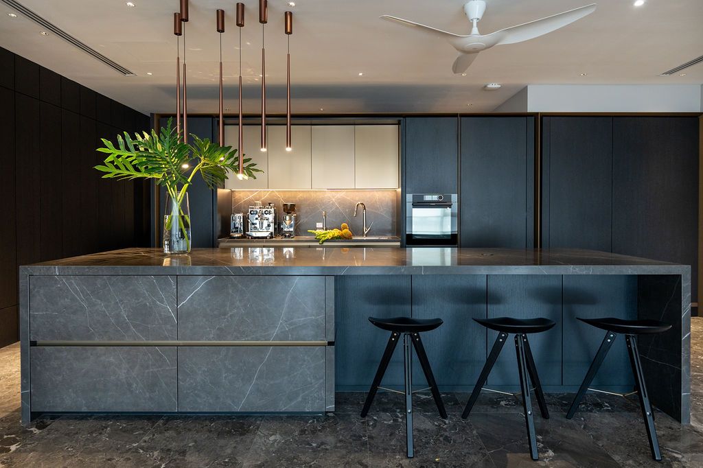 The dry kitchen has a darker feel compared to the living room