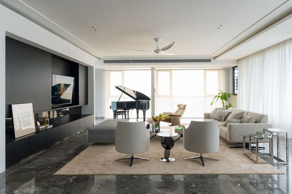 The living area is awash with natural light, elegant shapes and refined textures