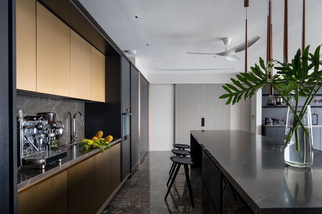 The dry kitchen has a darker feel compared to the living room