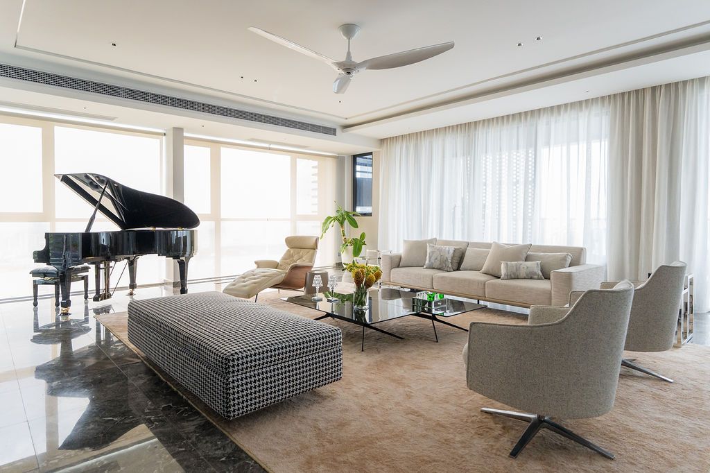 The living area is awash with natural light, elegant shapes and refined textures