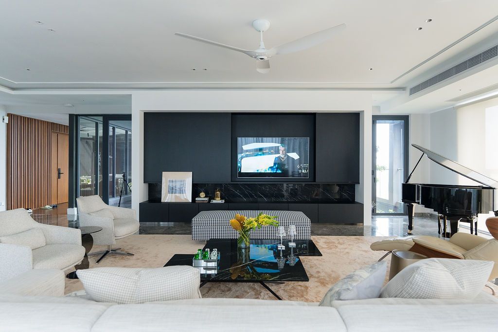 The living area is awash with natural light, elegant shapes and refined textures