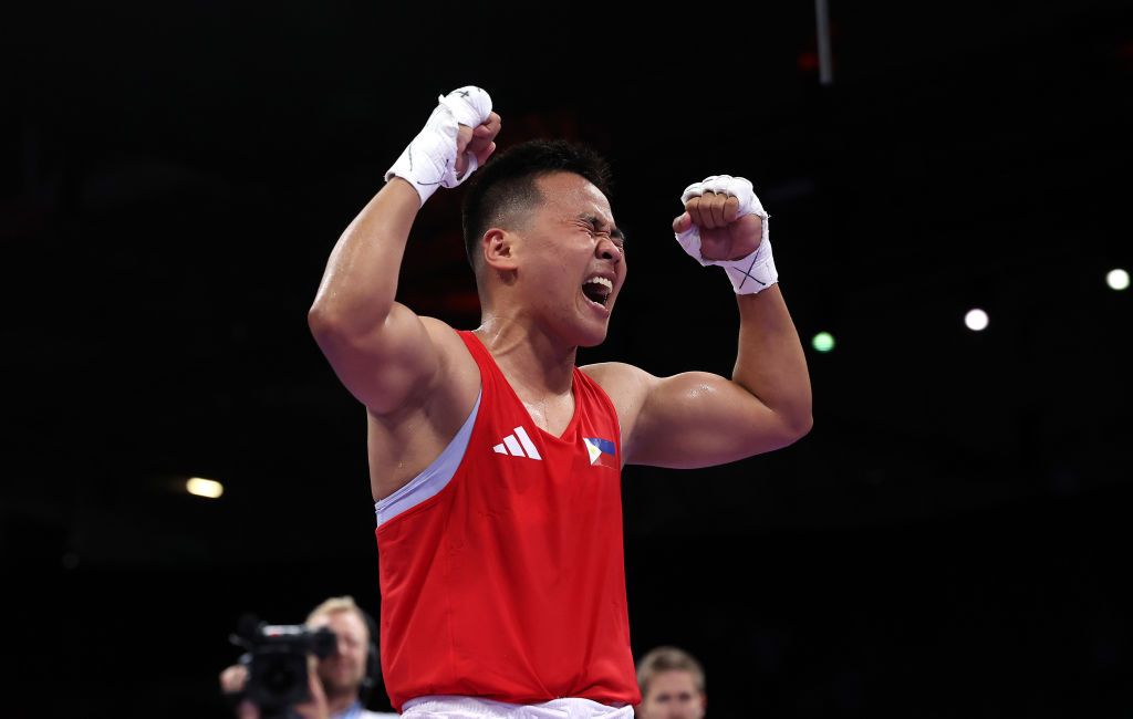 Nesthy Petecio of Team Philippines celebrates victory against Zichun Xu of Team People's Republic of China (Photo: Richard Pelham / Getty Images)