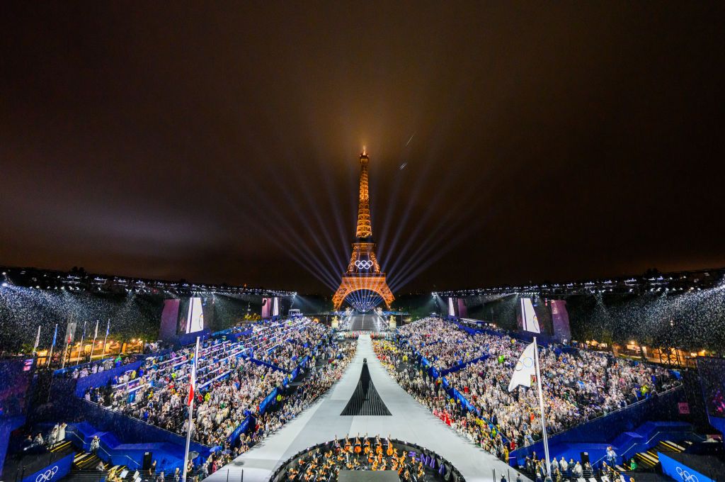 PARIS, FRANCE - JULY 26: The Olympic flag is rasied at the Place du Trocadero in front of the Eiffel Tower during the Opening Ceremony of the Olympic Games Paris 2024 on July 26, 2024 in Paris, France. (Photo by François-Xavier Marit-Pool/Getty Images)