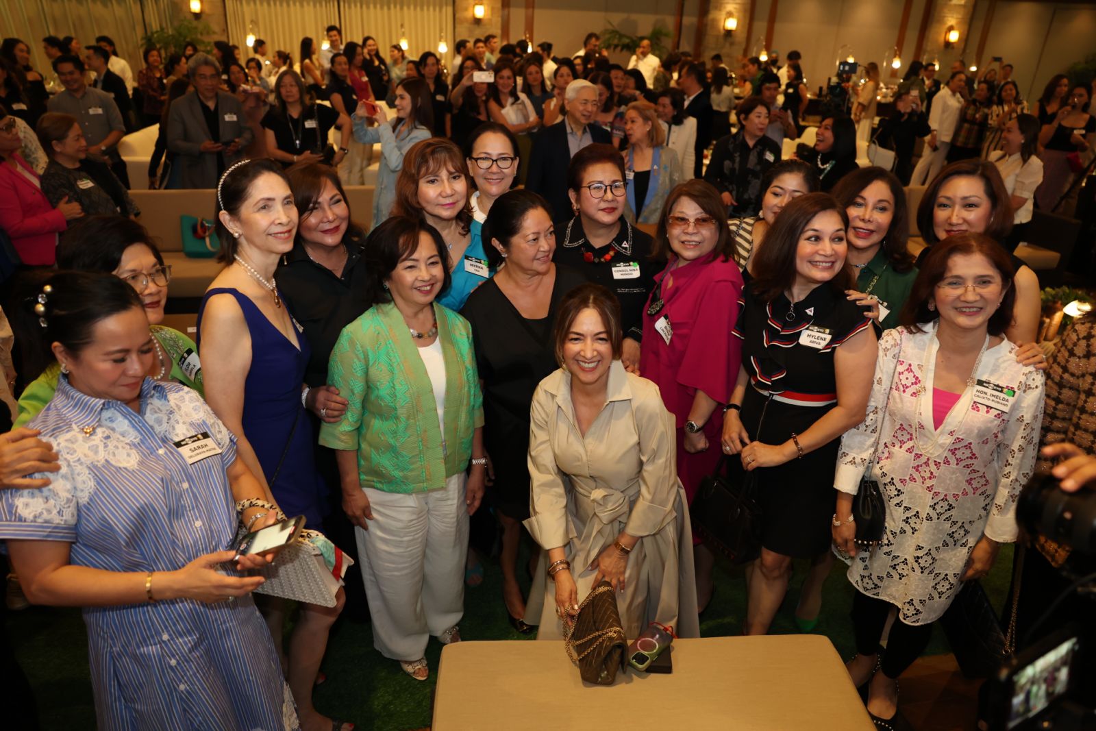 First Lady Liza Araneta Marcos posing with guests at the Go Negosyo Women in Collaboration for MSME Development Cocktail Party
