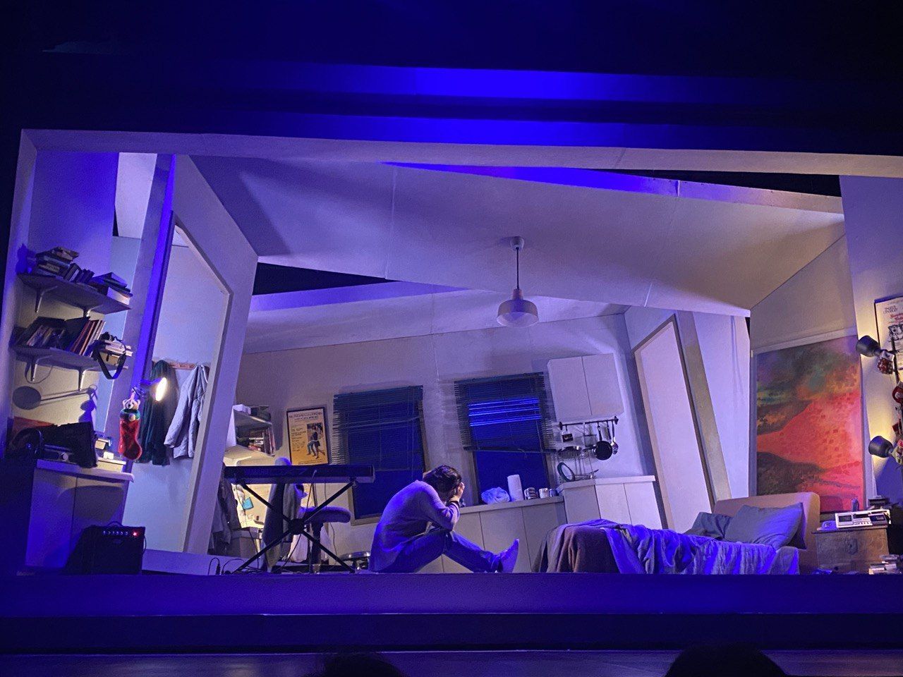The set of 9Works Theatrical's 'Tick, Tick... Boom!' (2023) distorting to display Jon's broken state of mind