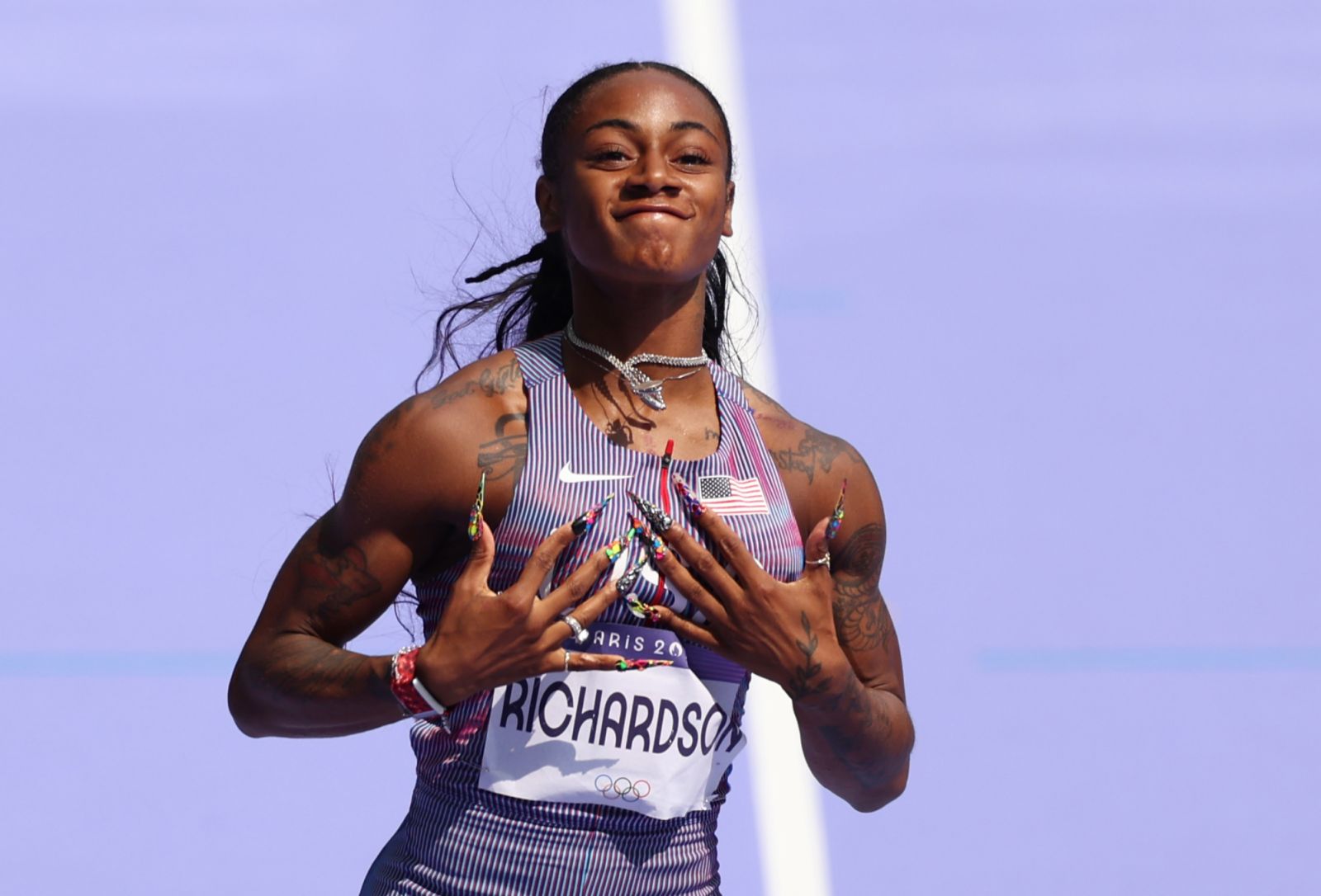 PARIS, FRANCE - AUGUST 02: Sha'carri Richardson of Team United States celebrates during the Women's 100m Round 1 on day seven of the Olympic Games Paris 2024 at Stade de France on August 02, 2024 in Paris, France. (Photo by Hannah Peters/Getty Images)
