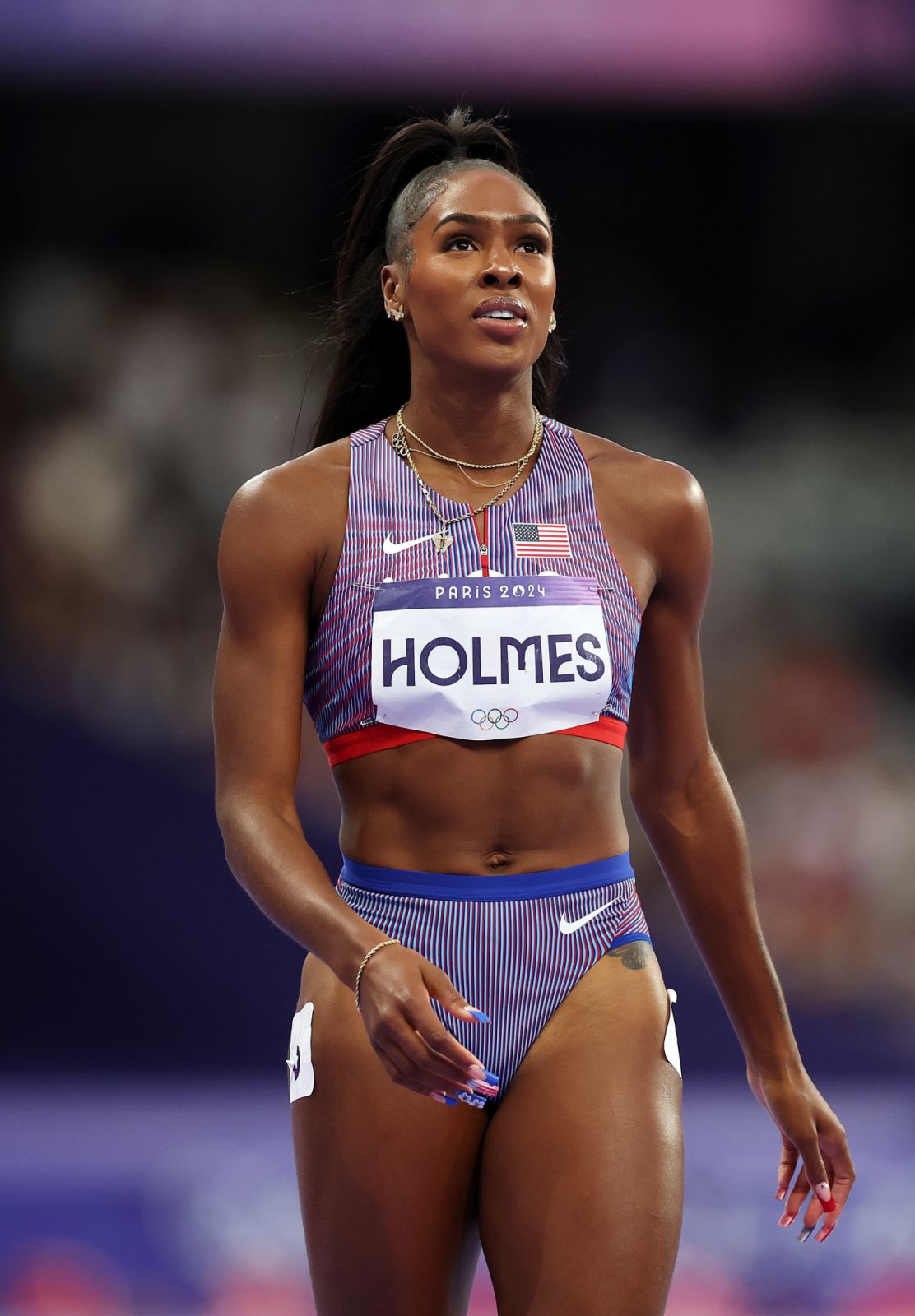 PARIS, FRANCE - AUGUST 07: Alexis Holmes of Team United States reacts after competing in the Women's 400m Semi-Final on day twelve of the Olympic Games Paris 2024 at Stade de France on August 07, 2024 in Paris, France. (Photo by Patrick Smith/Getty Images)