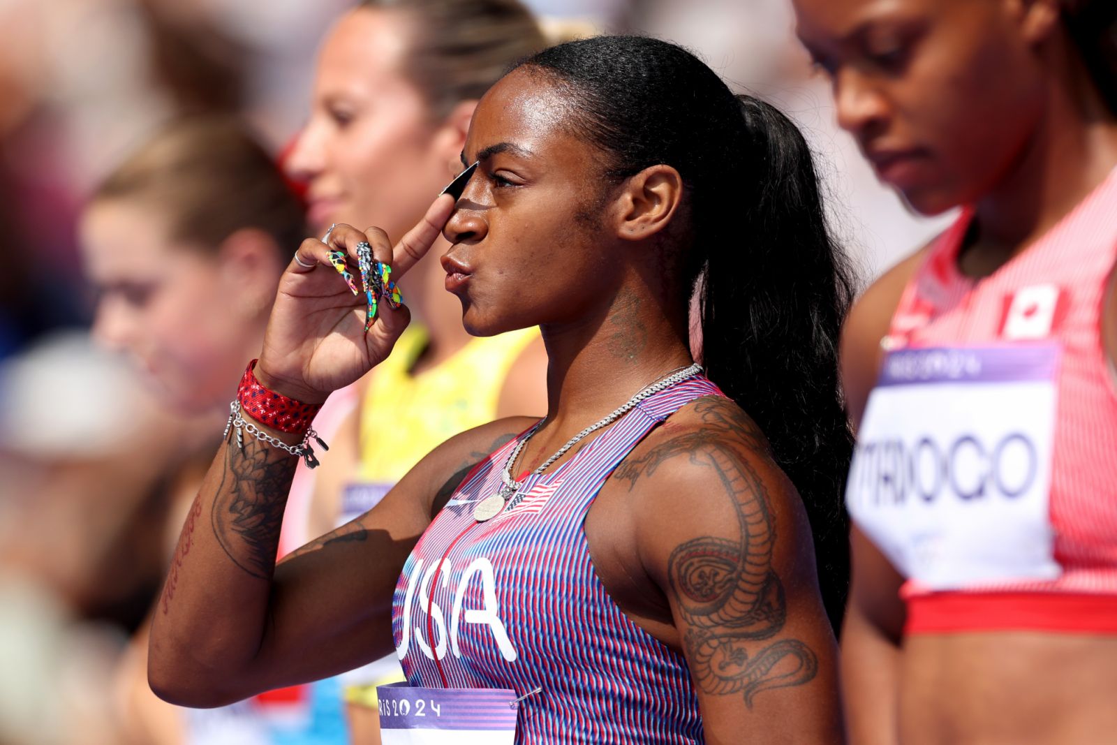 PARIS, FRANCE - AUGUST 02: Sha'carri Richardson of Team United States gestures during the Women's 100m Round 1 on day seven of the Olympic Games Paris 2024 at Stade de France on August 02, 2024 in Paris, France. (Photo by Michael Steele/Getty Images)