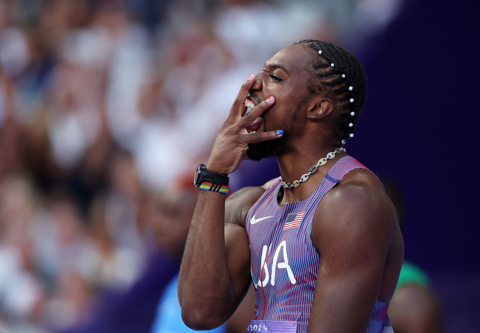 PARIS, FRANCE - AUGUST 04: Noah Lyles of Team United States reacts during the Men's 100m Semi-Final on day nine of the Olympic Games Paris 2024 at Stade de France on August 04, 2024 in Paris, France. (Photo by Cameron Spencer/Getty Images)