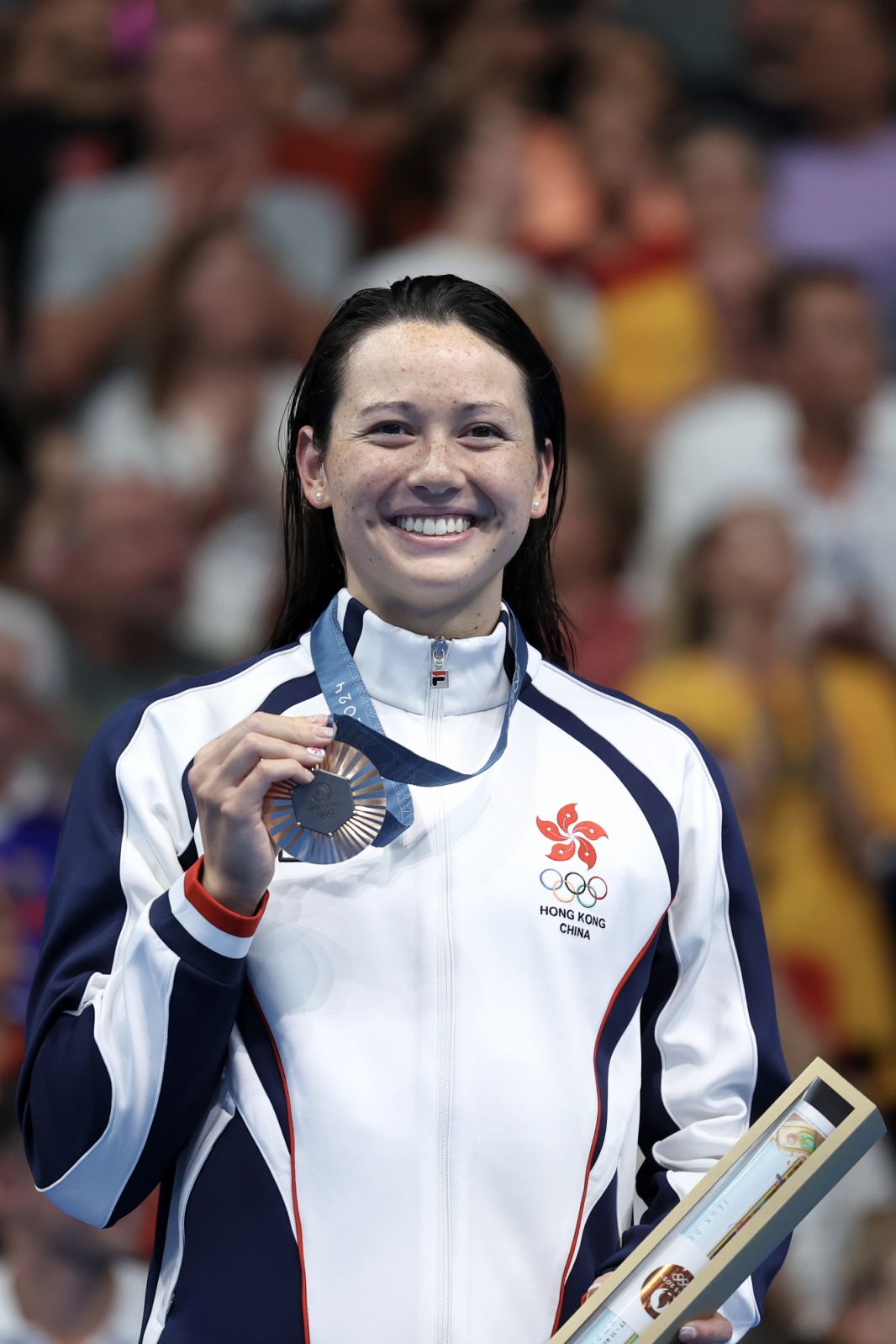 NANTERRE, FRANCE - JULY 31: Bronze Medalist Siobhan Bernadette Haughey of Team Hong Kong poses on the podium during the Swimming medal ceremony after the Women's 100m Freestyle Final on day five of the Olympic Games Paris 2024 at Paris La Defense Arena on July 31, 2024 in Nanterre, France. (Photo by Quinn Rooney/Getty Images)