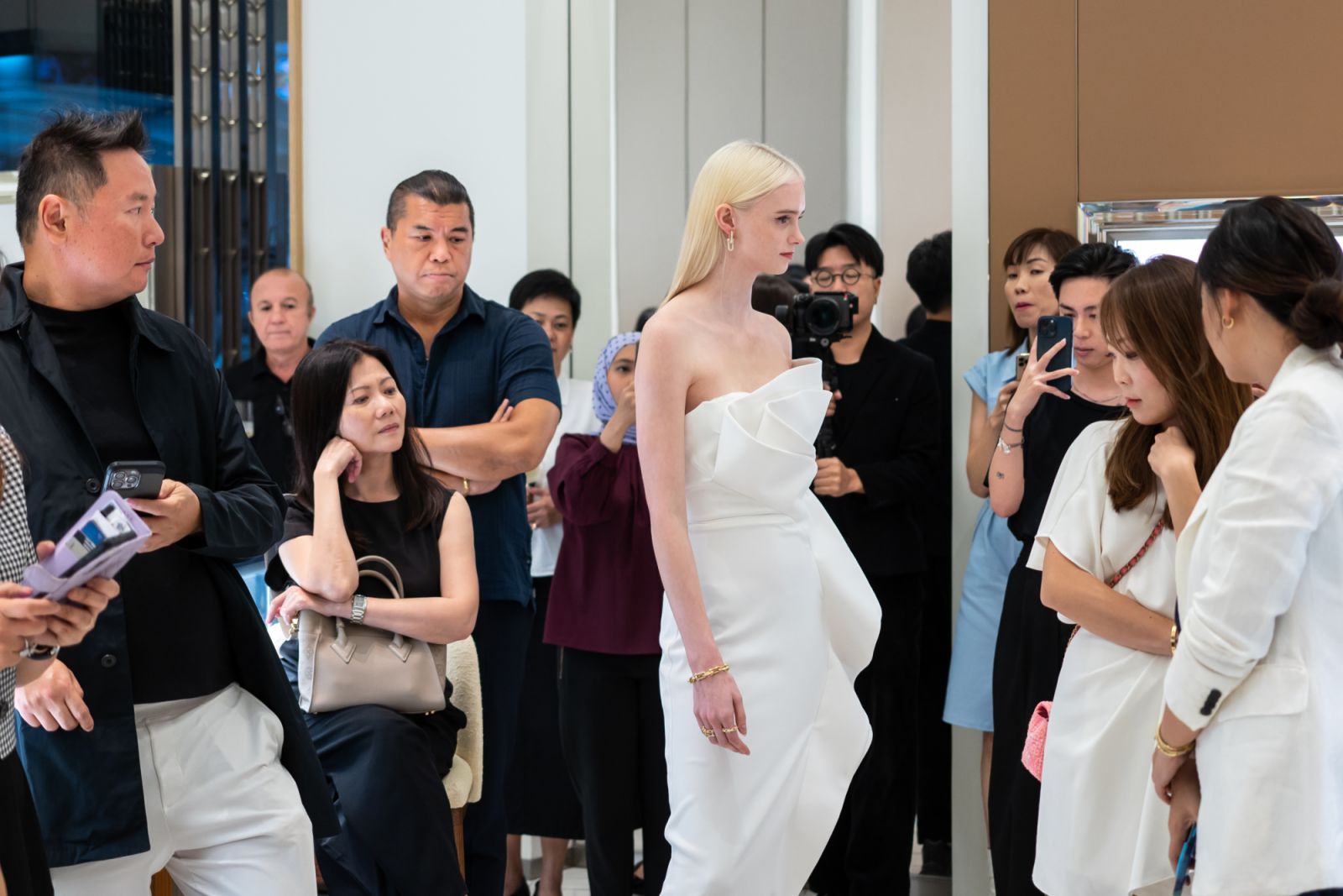Models walked down the boutique to give guests a closer look
