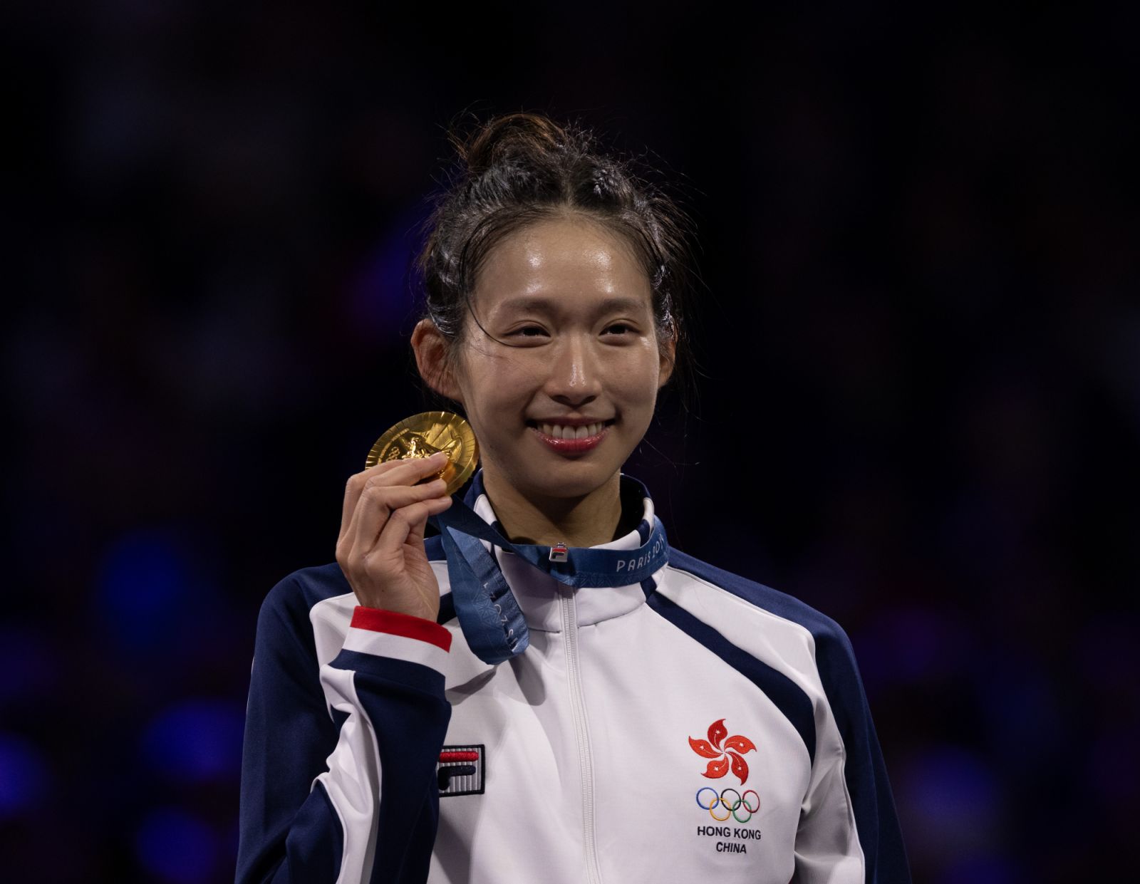 Gold medalist Man Wai Vivian Kong of Team Hong Kong celebrates on the podium during the Women's Épée Individual meadal ceremony on day one of the Olympic Games Paris 2024 at Grand Palais on July 27, 2024 in Paris, France. (Photo by Tnani Badreddine/DeFodi Images via Getty Images)