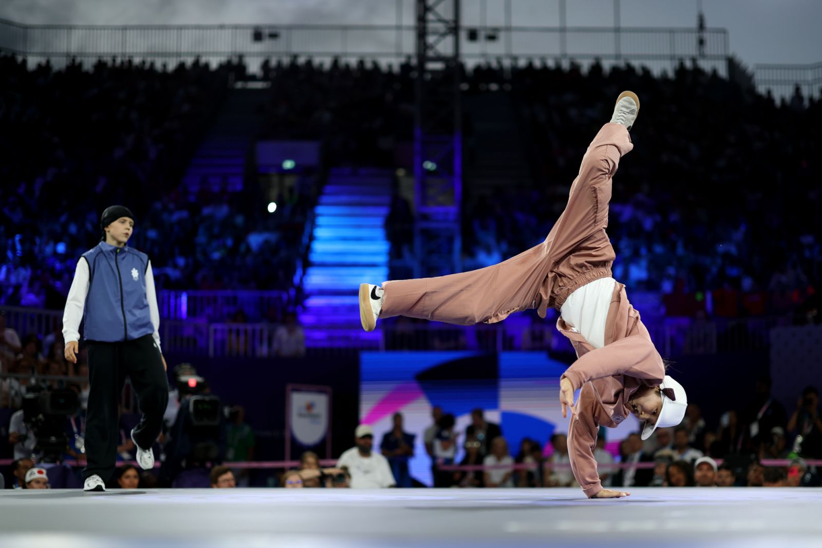 PARIS, FRANCE - AUGUST 09: Gold medalist B-Girl Ami of Team Japan competes in her victory over B-Girl Nicka of Team Lithuania in the Breaking B-Girls Gold medal battle on day fourteen of the Olympic Games Paris 2024 at Place de la Concorde on August 09, 2024 in Paris, France (Photo by Elsa/Getty Images)