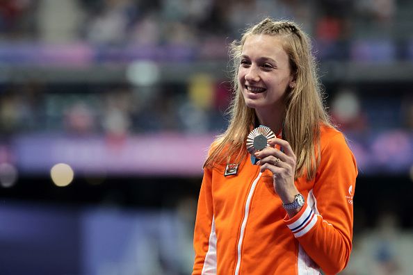 PARIS, FRANCE - AUGUST 09: Bronze medalist Femke Bol of Team Netherlands celebrates on the podium during the Women's 400m Hurdles medal ceremony on day fourteen of the Olympic Games Paris 2024 at Stade de France on August 09, 2024 in Paris, France. (Photo by Jean Catuffe/Getty Images)
