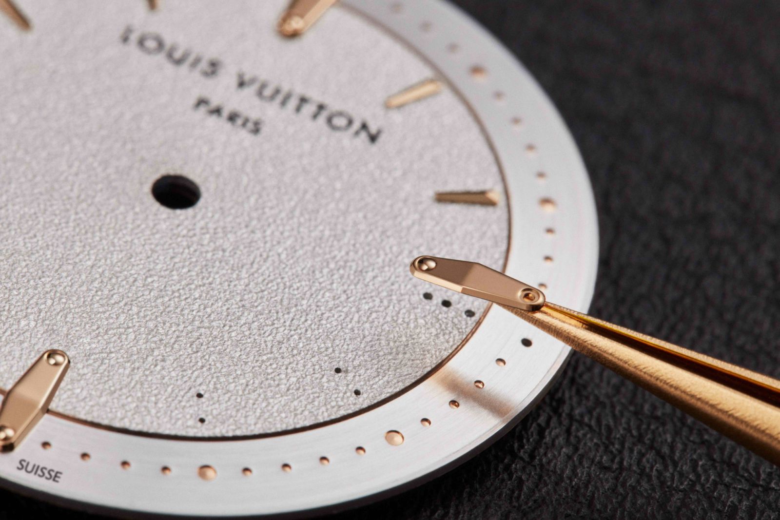 Decorative rivets on the dial are a another reference to the iconic Louis Vuitton trunk