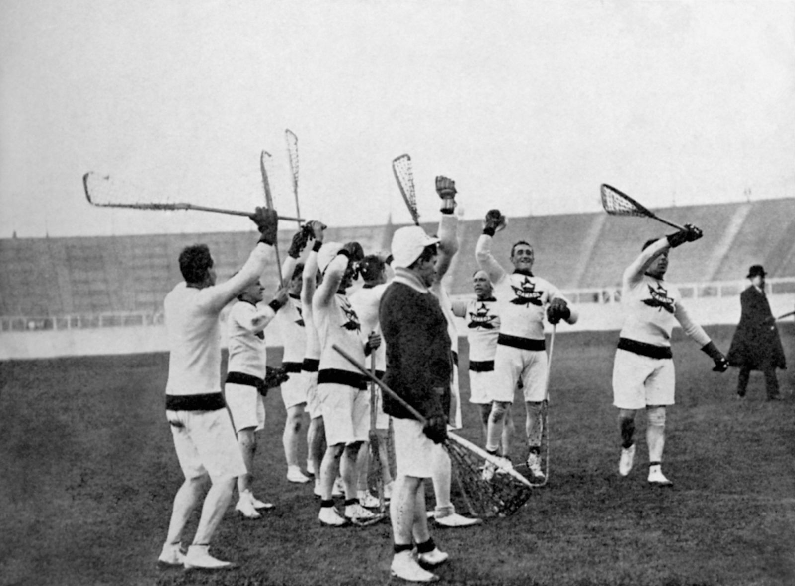 The gold medal winning Canada team offer three hearty cheers for their defeated opponents  (Photo by S&G/PA Images via Getty Images)