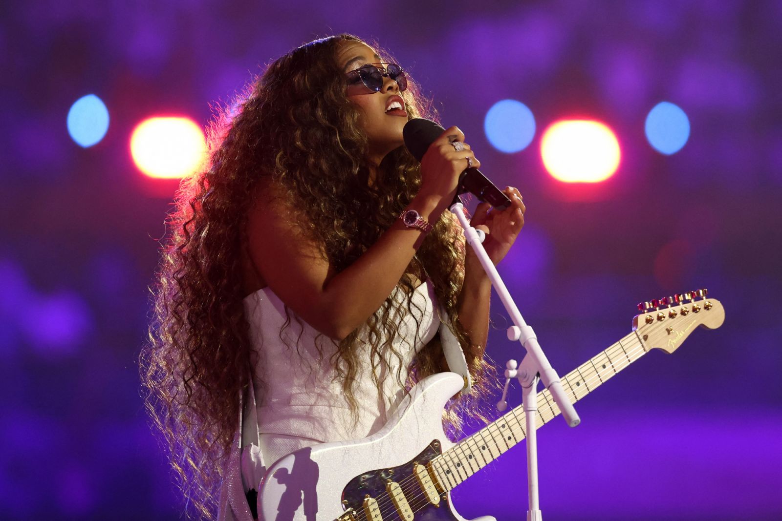 US singer H.E.R performs during the closing ceremony of the Paris 2024 Olympic Games at the Stade de France, in Saint-Denis, in the outskirts of Paris, on August 11, 2024. (Photo by Franck FIFE / AFP) (Photo by FRANCK FIFE/AFP via Getty Images)