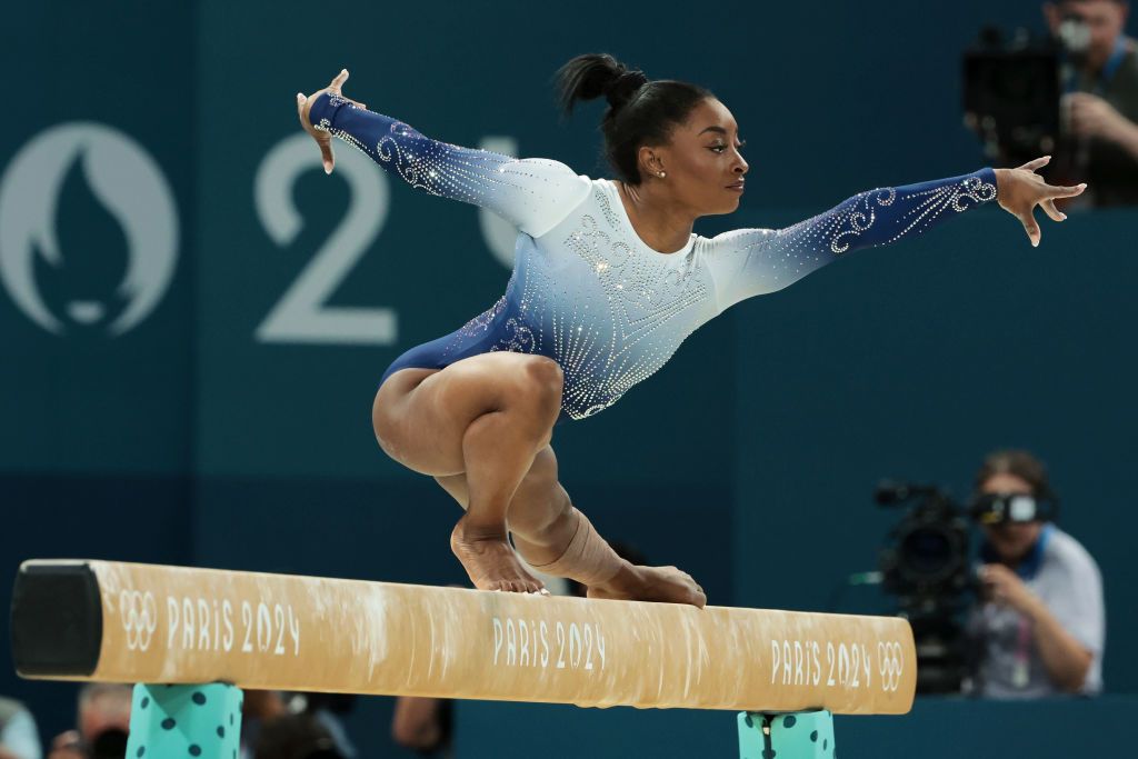 PARIS, FRANCE - AUGUST 05: Simone Biles of Team United States competes during the Artistic Gymnastics Women's Balance Beam Final on day ten of the Olympic Games Paris 2024 at Bercy Arena on August 05, 2024 in Paris, France. (Photo by Jean Catuffe/Getty Images)