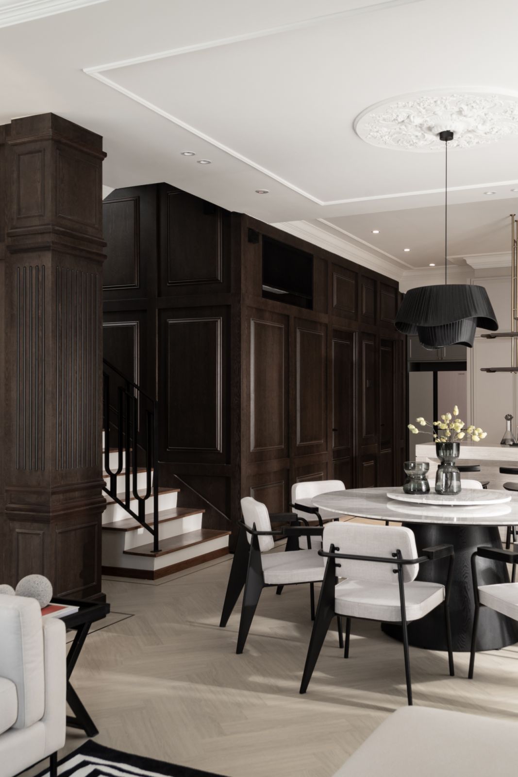 Handsome wooden panelling anchors the living space (Photo: TWJPTO)