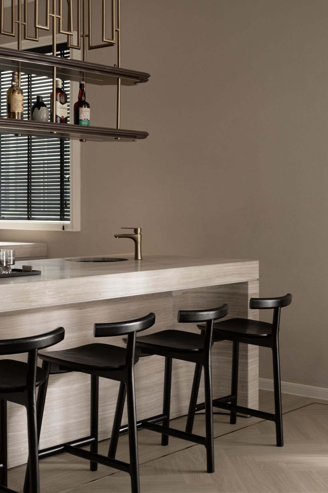 Sculptural bar stools and sleek lines from the bar counter (Photo: TWJPTO)