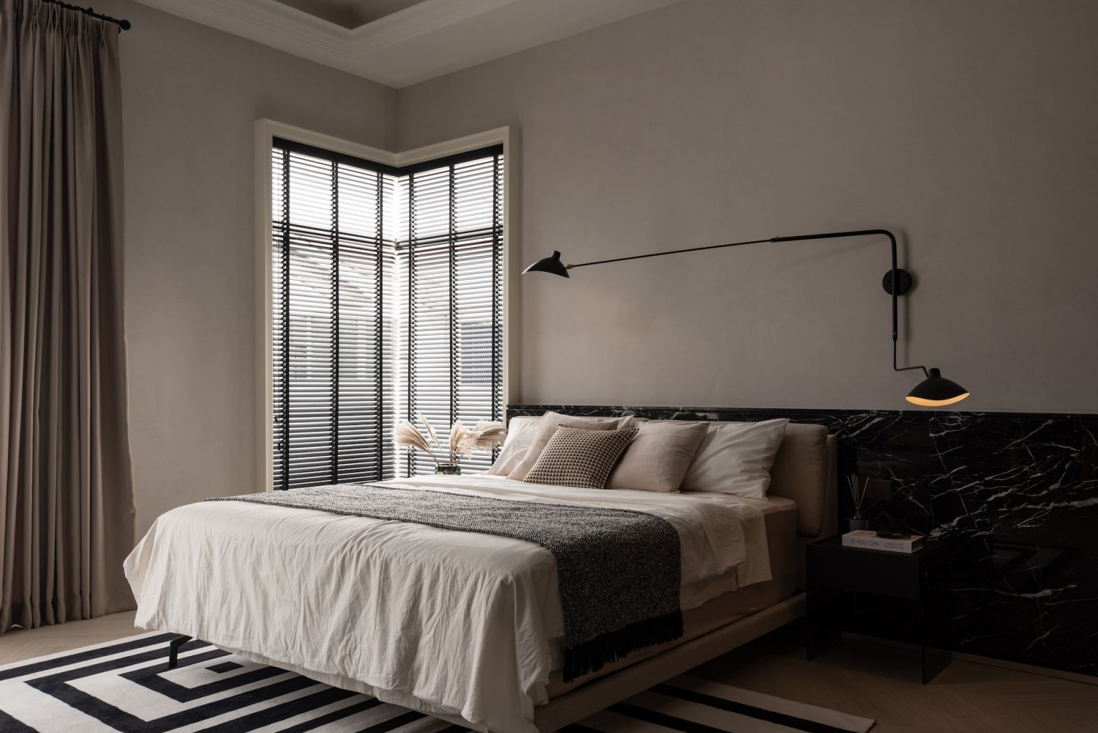 The serene master bedroom imbued with quiet luxury (Photo: TWJPTO)