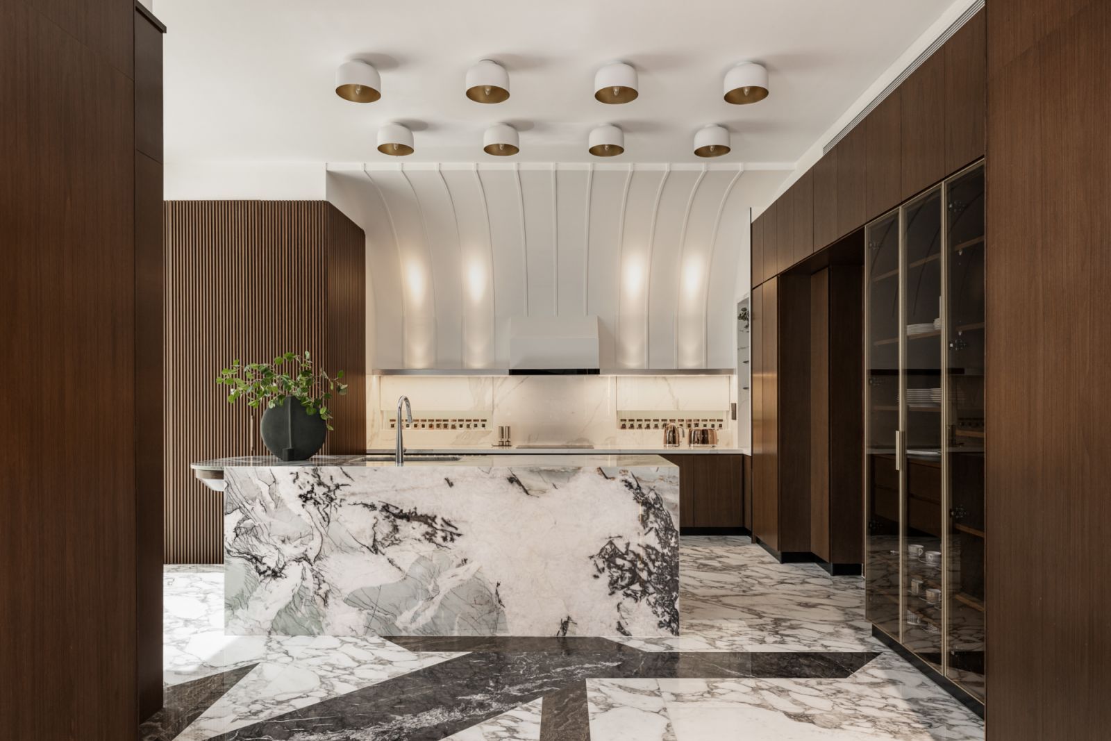 Marble creates tension with demure wood in the dry kitchen (Photo: The Space Storyteller)