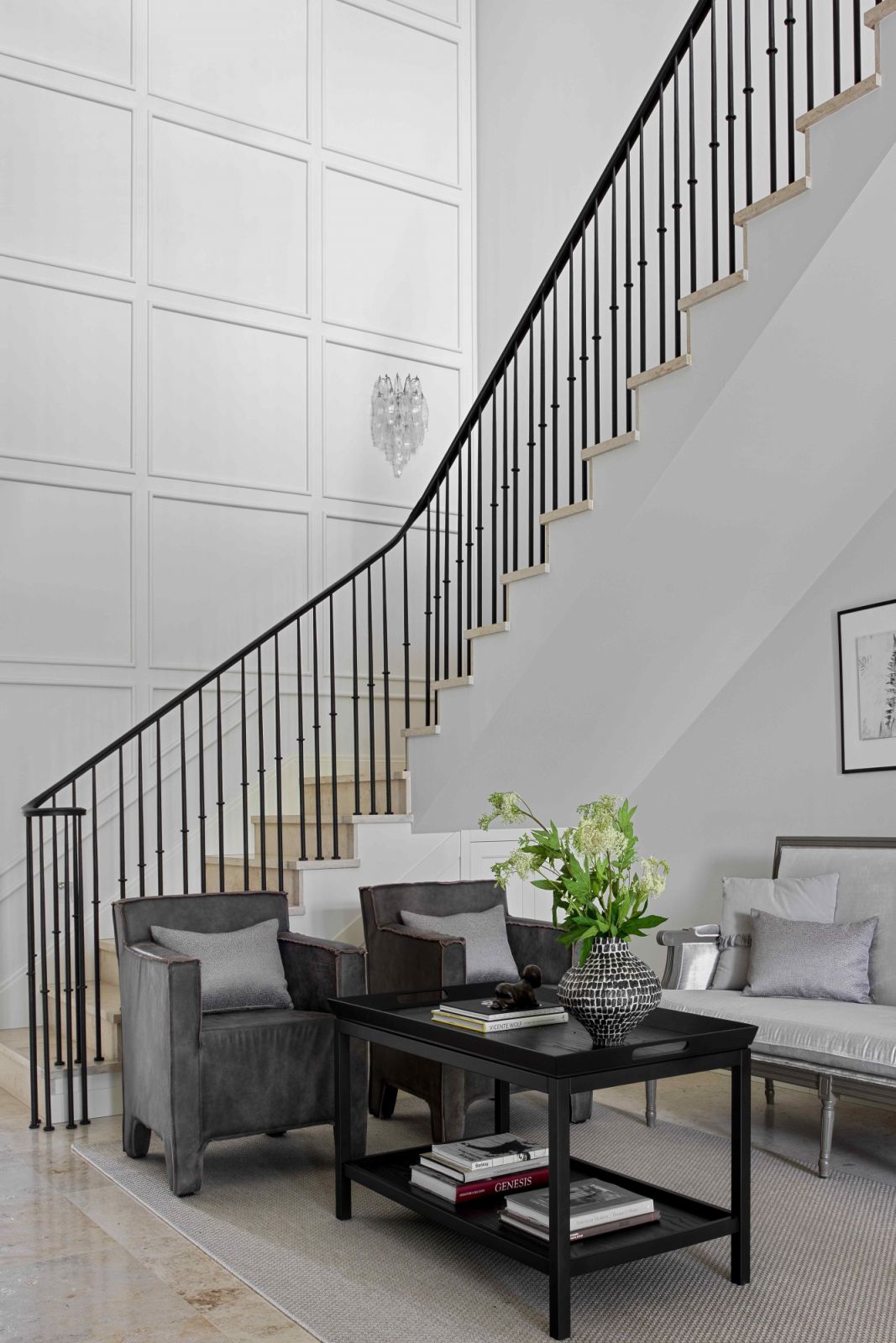 The entrance hall with white panelled walls