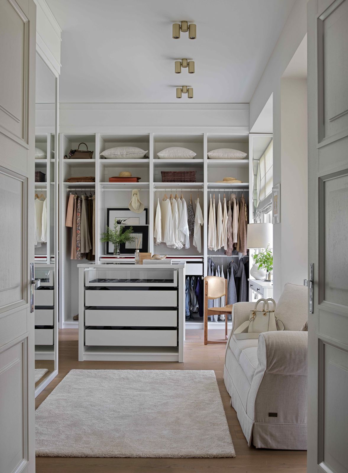 The spacious walk-in closet custom-built with coherence and functionality