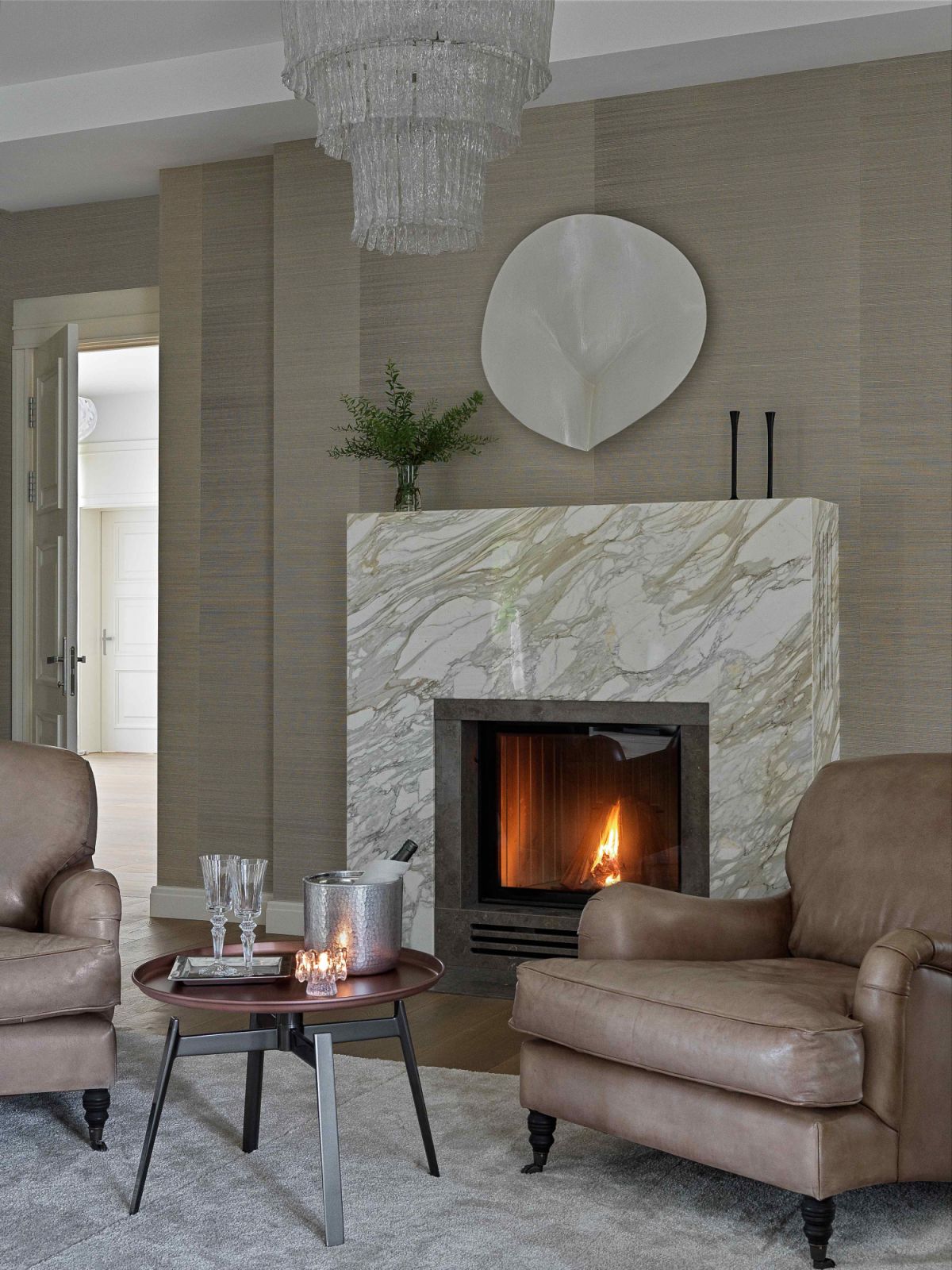 A vintage C.Jeré piece over the custom Taj Mahal marble fireplace