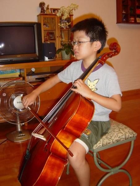 Leung, who was eight year old, practiced cello at home (Photo: Elliot Leung)