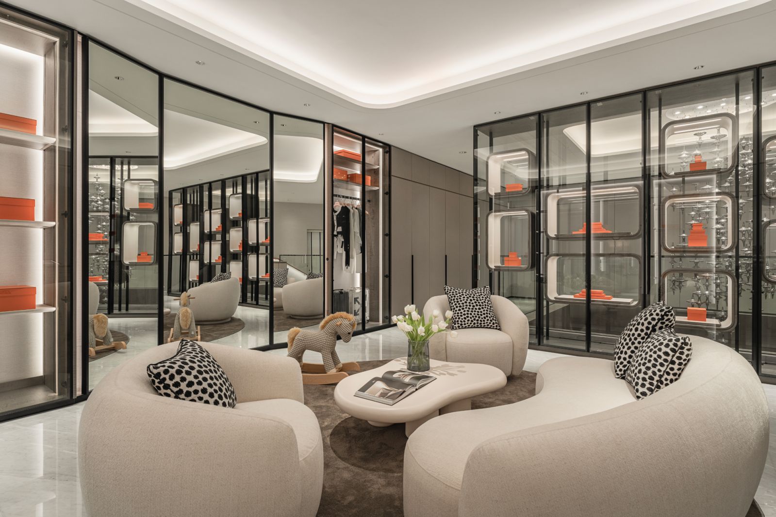 The boutique-style interior is complete with sleek display cases and plush, cosy seating