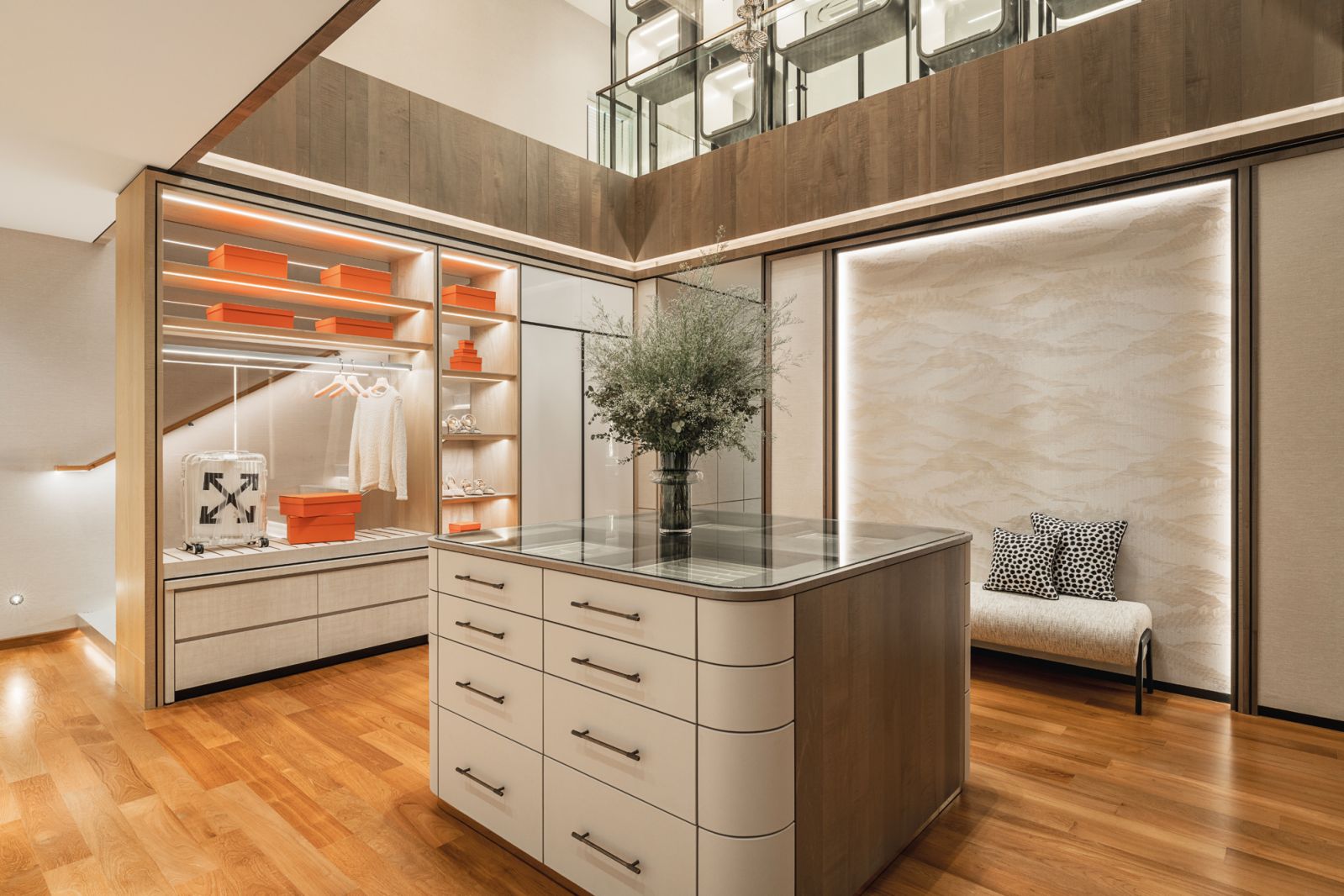 The two-level wardrobe area is decked out like a high-end fashion boutique