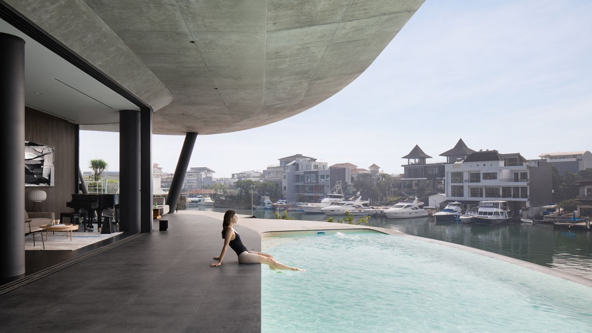 The infinity pool overlooks the Pantai Mutiara canal