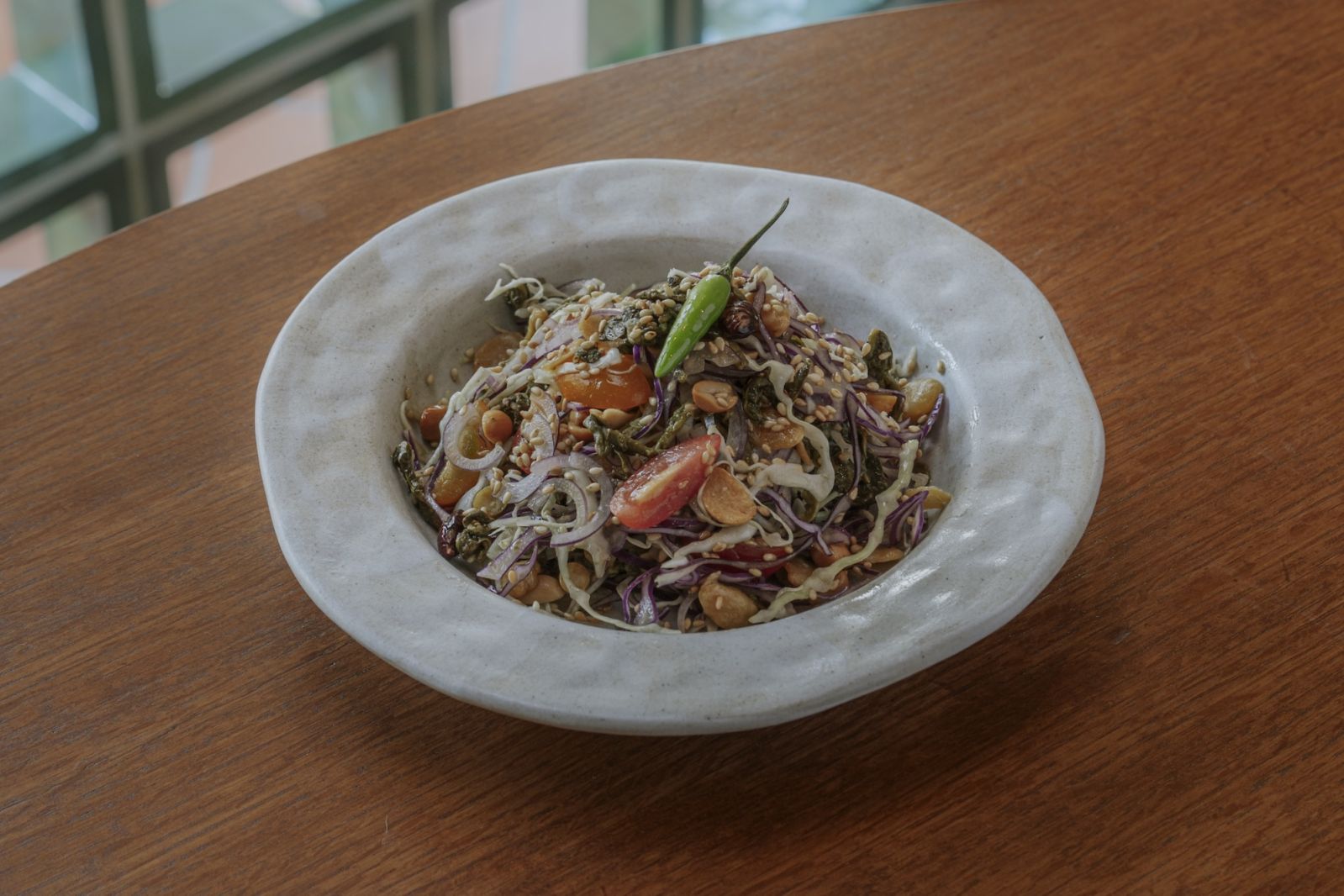 Laphet thoke is a fermented tea leaves salad with crunchy broad beans, a prime example of a Burmese staple (Photo: Club Rangoon)