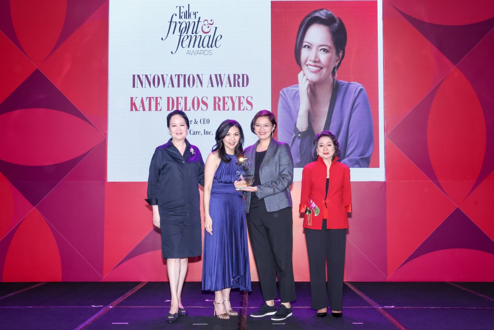 Kate Delos Reyes receiving the Innovation Award, presented by Frannie Jacinto, Kaye Tinga and Chit Lijauco
