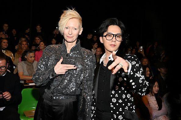 PARIS, FRANCE - JANUARY 24: (EDITORIAL USE ONLY - For Non-Editorial use please seek approval from Fashion House) Tilda Swinton and G-Dragon attend the Chanel Haute Couture Spring Summer 2023 show as part of Paris Fashion Week on January 24, 2023 in Paris, France. (Photo by Stephane Cardinale - Corbis/Corbis via Getty Images)