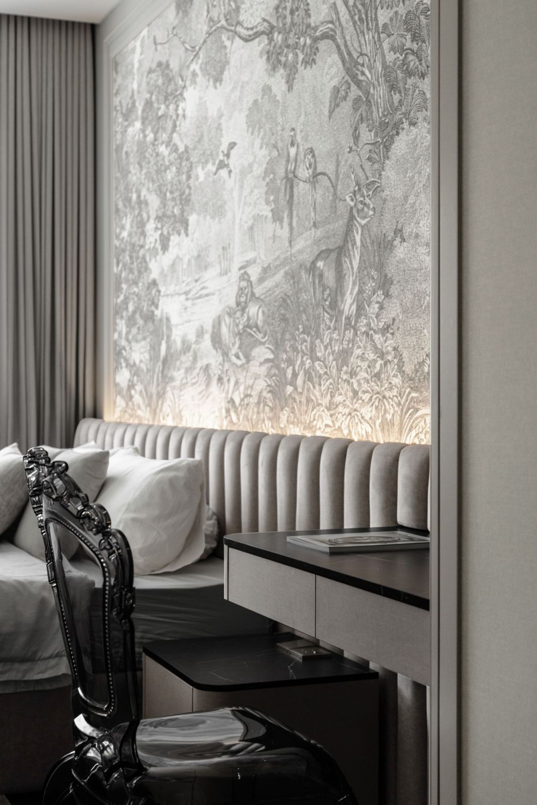 The master bathroom has a darker colour and material palette