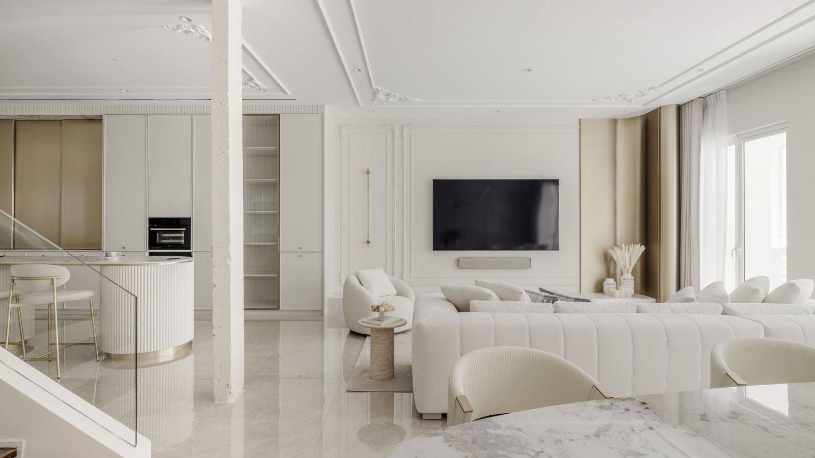 The open-concept kitchen seamlessly connects to the living and dining areas