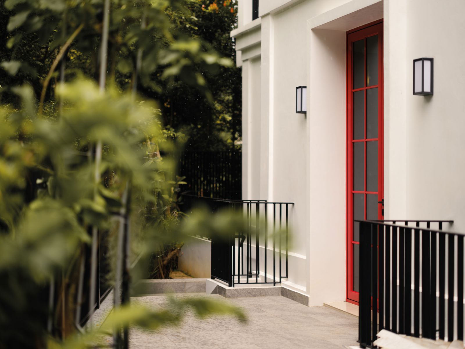 The red door catches the eye from the outside