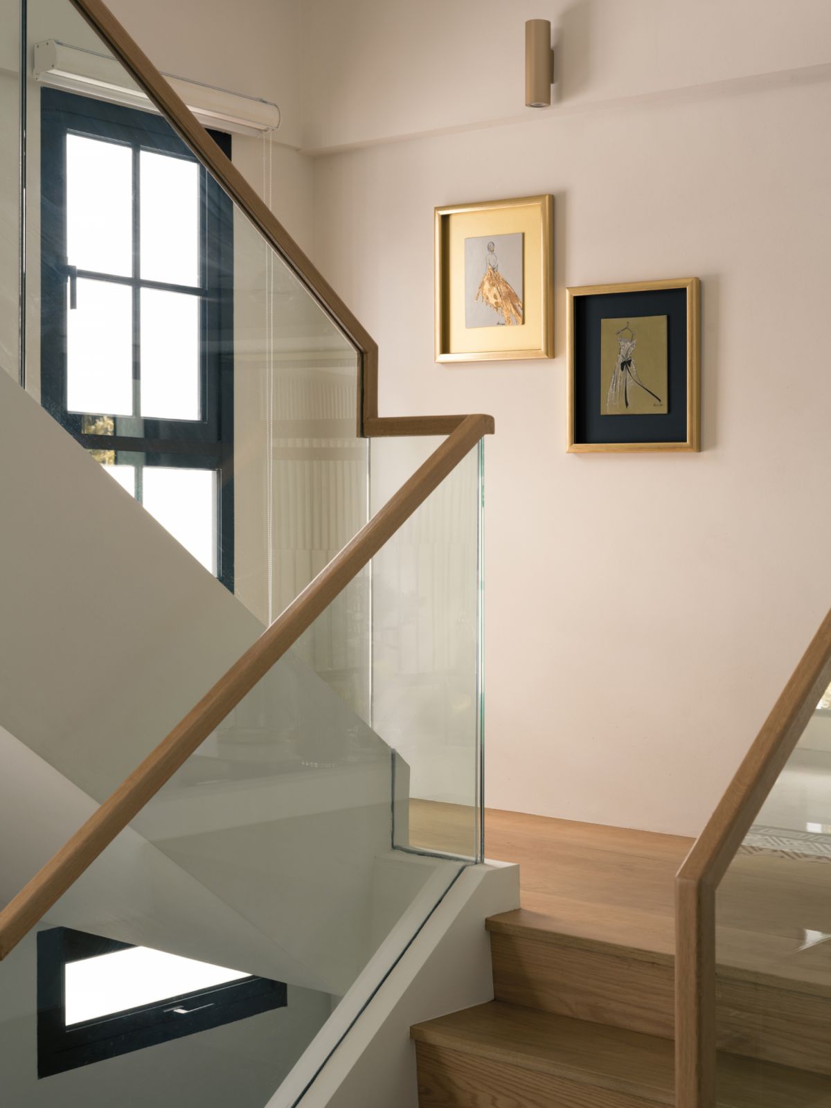 Carefully installed artworks bring a gilded edge to this staircase landing