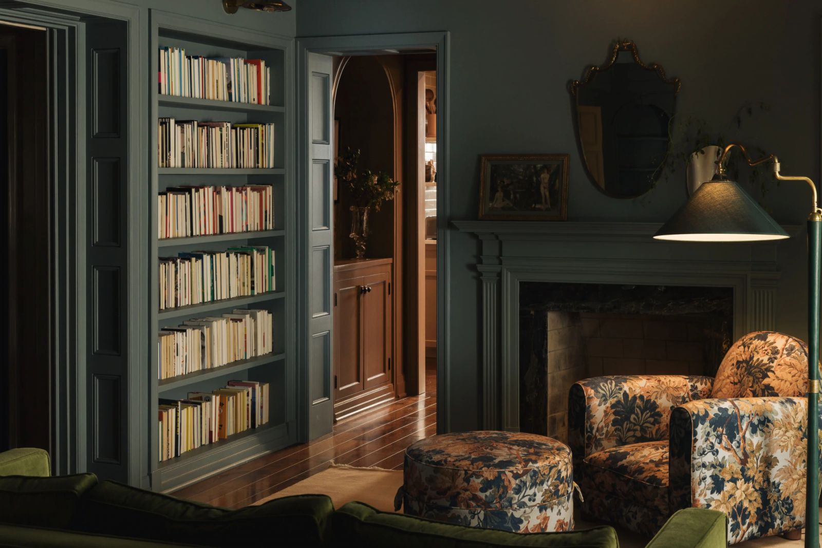 The quiet library enclave with deep green walls and carpentry