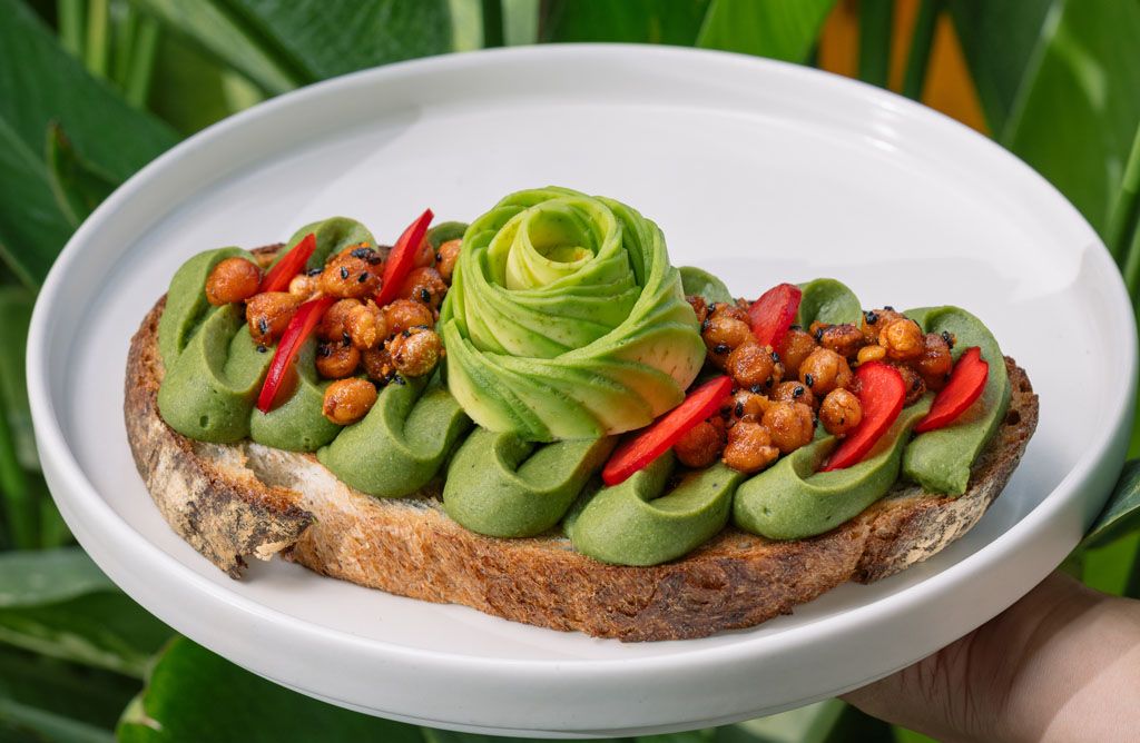 Hummus toast, one of The Avocado Factory's offerings of avocado toast featuring sourdough topped with an avocado-hummus spread and crispy chickpeas (Photo: The Avocado Factory)