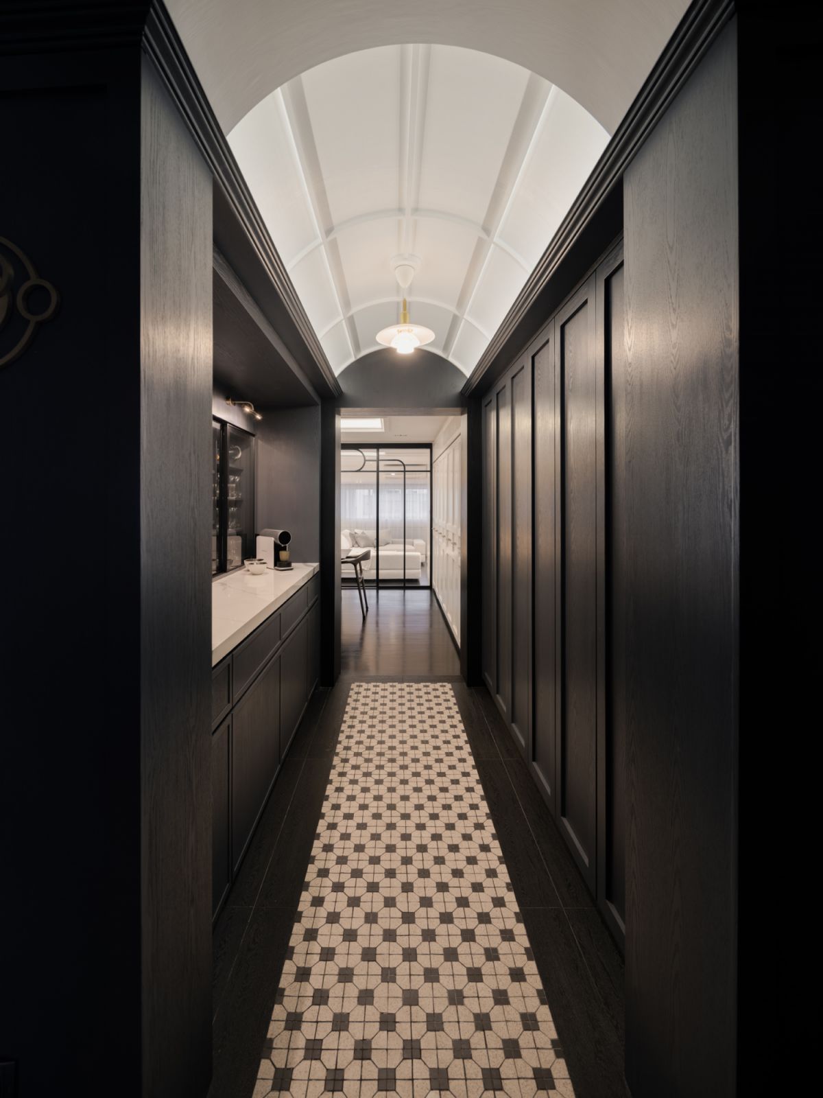 The dry pantry was fitted along the walkway to the dining room, enhanced by a curved ceiling