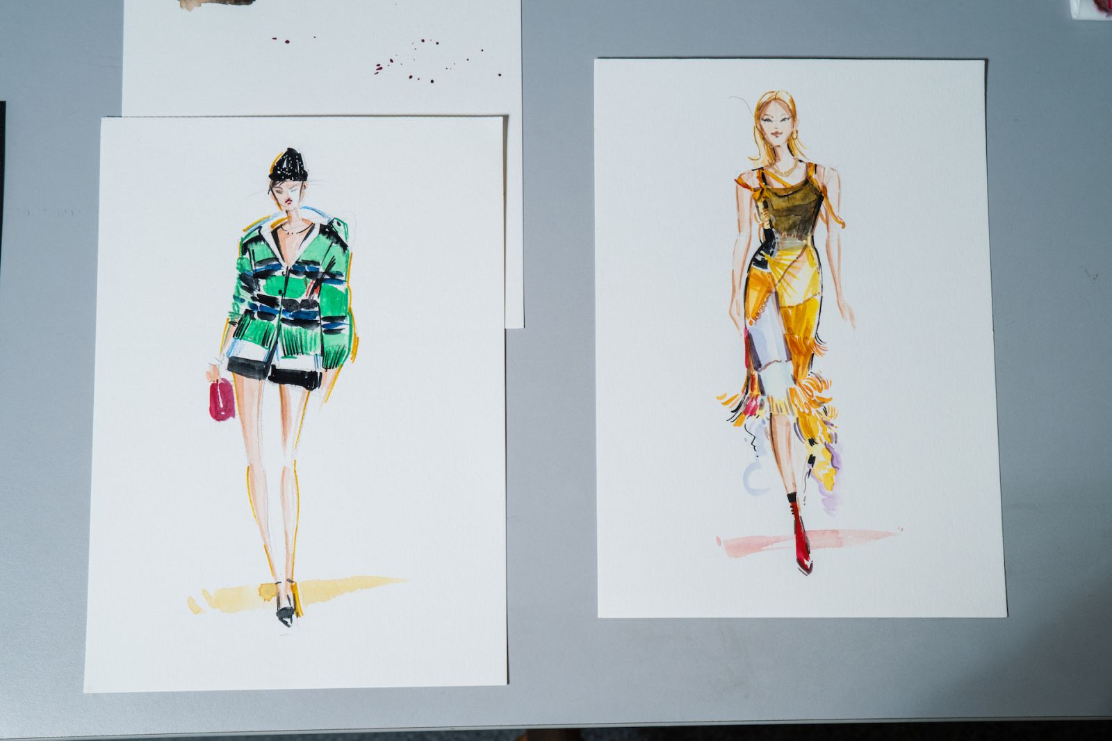 Completed fashion illustration by Tan of runway looks